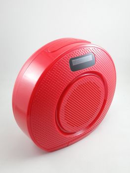 Bluetooth wireless speaker in red color use to play music from smartphone
