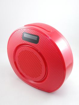 Bluetooth wireless speaker in red color use to play music from smartphone