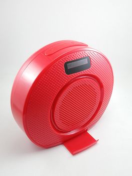 Bluetooth wireless speaker in red color use to play music from smartphone