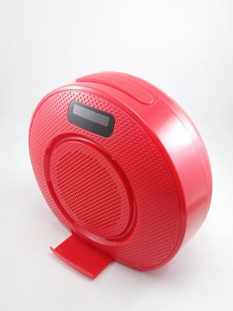 Bluetooth wireless speaker in red color use to play music from smartphone