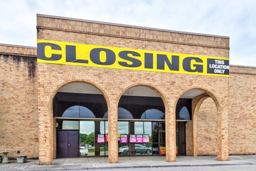 Horizontal shot of a bankrupt retail anchor store going out of business due to the pandemic.