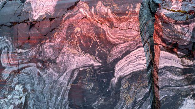 Raw natural striped marble with a background texture pattern, with lilac lighting