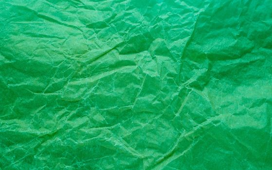 Rumpled paper texture green. Texture of crumpled paper. Crumpled paper. Wrinkles paper.