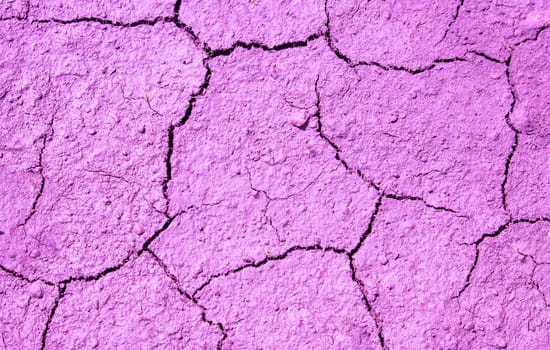 Pink cracked surface with a rough texture.Abstract background.