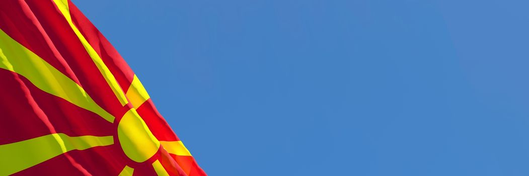 3D rendering of the national flag of Macedonia waving in the wind against a blue sky