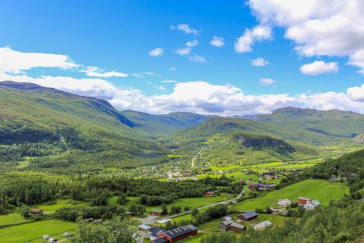 Panorama Norway, Hemsedal Mountains, red farmhouses and green meadows, Viken, Buskerud.