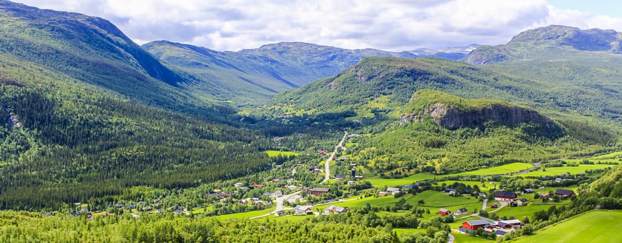 Panorama Norway, Hemsedal Mountains, red farmhouses and green meadows, Viken, Buskerud.