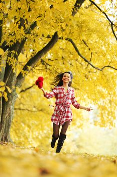 autumn happy woman portrait run in park