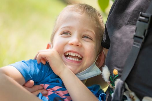 Close up portrait of cute little son hug cuddle laughing enjoying free time together, little boy child smile hug shows love and care