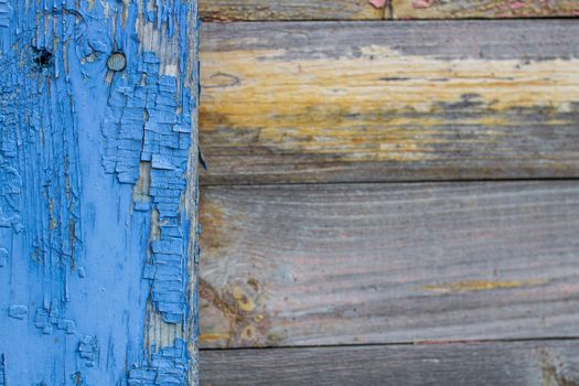 Blue old paint on the Board. Wooden background made of old boards. The texture of an old rustic wooden fence made of flat processed boards. Background design