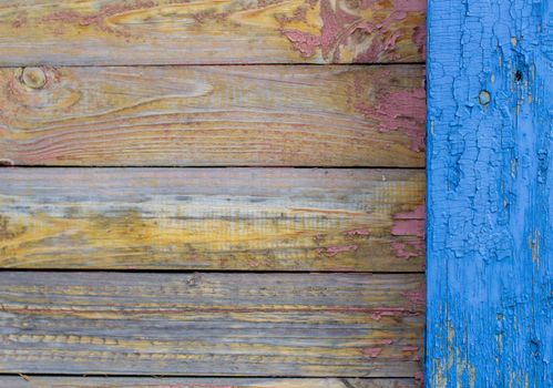 Blue old paint on the Board. Wooden background made of old boards. The texture of an old rustic wooden fence made of flat processed boards. Background design
