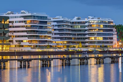 Modern apartment buildings at the river Spree in Berlin at dusk