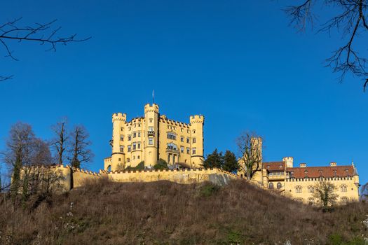 Beautiful view of the famous Hohenschwangau Castle on a sunny day in winter, Schwangau, Bavaria, Germany