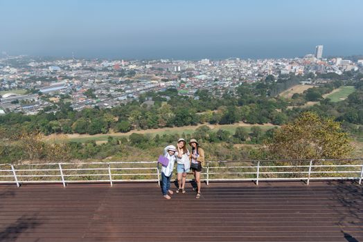 Asian pretty cute women with hat relax at seaside city landscape viewpoint on mountain with happy and freedom emotion in concept travel, vacation, leisure in life