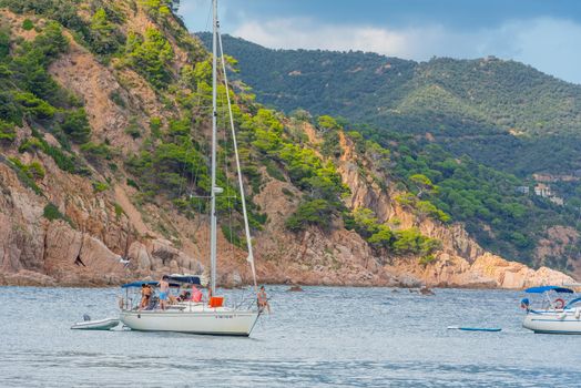 Cala Futadera, Spain : 2020 Sept 02 : Boats in the Beautiful Cala Futadera beach is one of the few remaining natural unspoiled beaches on the Costa Brava, Catalonia, Spain in summer 2020