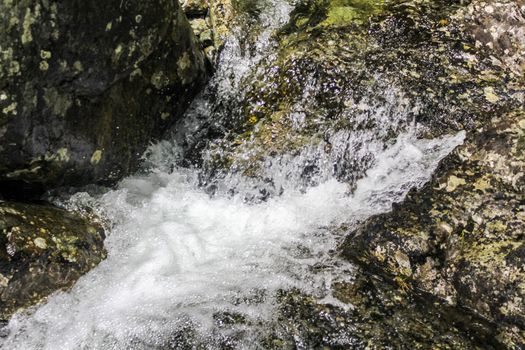 Flowing waterfall river Lake Hemsila in Hemsedal, Viken, Buskerud, Norway.