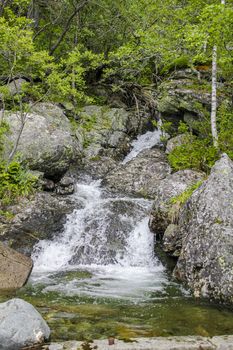 Flowing waterfall river Lake Hemsila in Hemsedal, Viken, Buskerud, Norway.