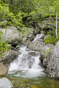 Flowing waterfall river Lake Hemsila in Hemsedal, Viken, Buskerud, Norway.