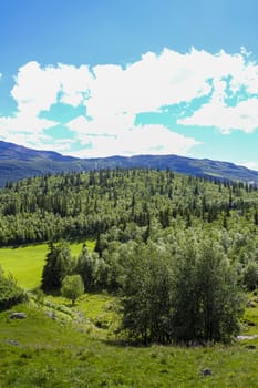 Spectacular landscape with blue sky and clouds row in beautiful Hemsedal, Viken, Buskerud, Norway.