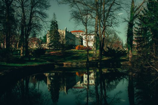 Looking at the Beautiful Elkins Estate Building in Elkins Park Over a Pond Surrounded by Trees