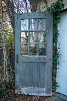 An Old Wooden Door With Glass Windows on an Antique Garage in Suburban Pennsylvania