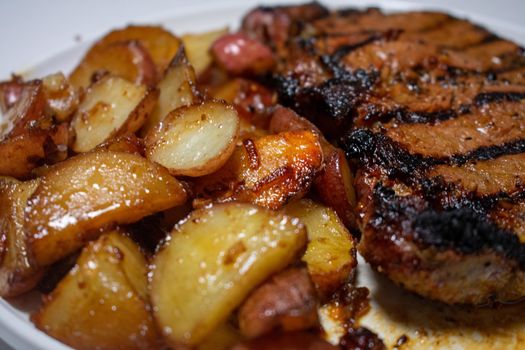 A Close Up Shot of Juicy Steak and Potatoes on a Pure White Background