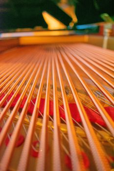A Low Angle Shot of Large Brass Strings of a Grand Piano