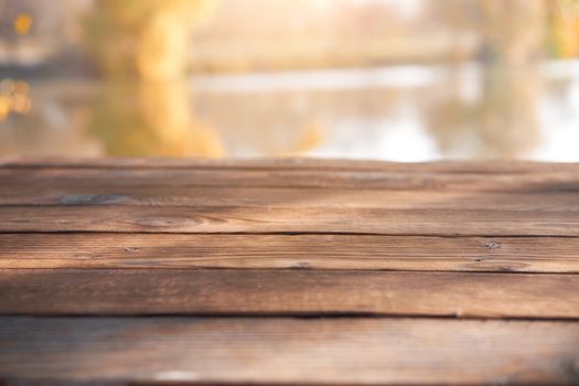 Empty wooden table nature bokeh background with a country outdoor theme,Template mock up for display of product Copy space Lake