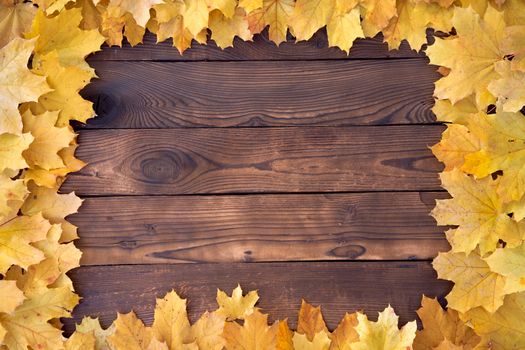 Autumn leaves Square frame on wooden background top view Fall Border yellow and Orange Leaves vintage wood table Copy space for text