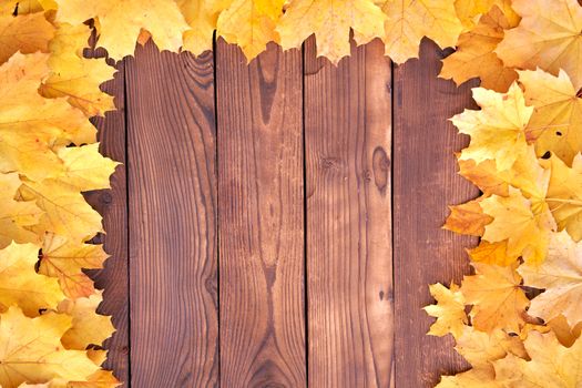 Autumn leaves Square frame on wooden background top view Fall Border yellow and Orange Leaves vintage wood table Copy space for text