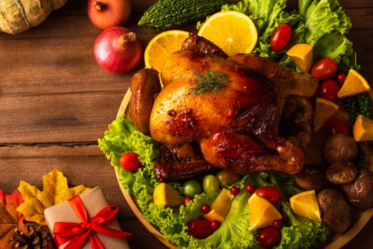 Thanksgiving roasted turkey or chicken and vegetables, Top view Christmas dinner feast food decoration traditional homemade on wooden table background, Happy thanksgiving day of holiday concept