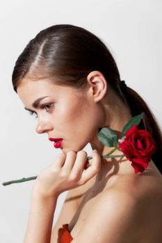 Lady with rose Bared shoulders red lips side view cute face cropped view