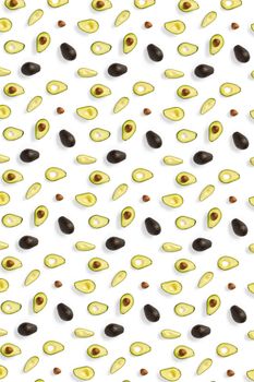 Avocado. Background made from isolated Avocado pieces on white background. Flat lay of fresh ripe avocados and avacado pieces