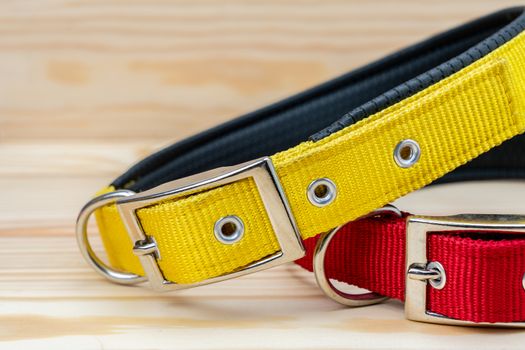 Pet collars stack for pet on wooden background