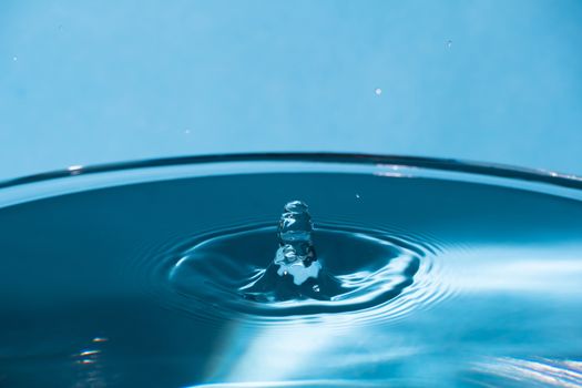 Abstract an outbreak of water. Splash of water close-up. Frozen water drop photographed at high speed.Slow dripping of liquid with air bubbles. Nature backgrounds or Wallpaper.Frozen liquid splashes