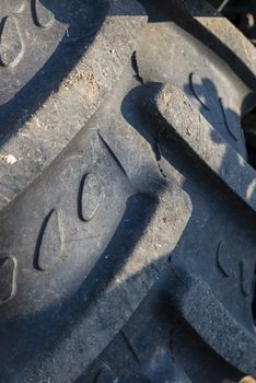 detail of a rear wheel tractor tire with carved designs