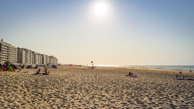 Wenduine, Belgium, September 2020: People enjoying an indian summer afternoon at Wenduine Beach at the Belgian coast