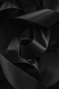 Black silk ribbon as background, abstract and luxury brand designs