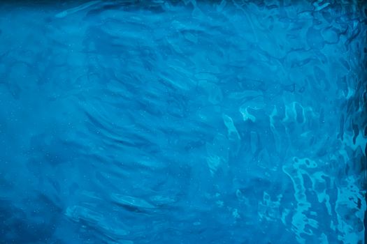 Blue water texture as abstract background, swimming pool and waves designs