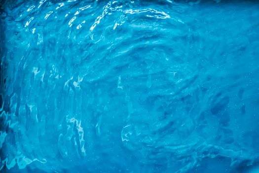 Blue water texture as abstract background, swimming pool and waves designs