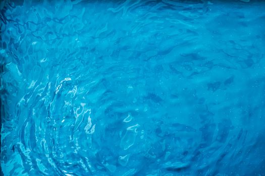 Blue water texture as abstract background, swimming pool and waves designs