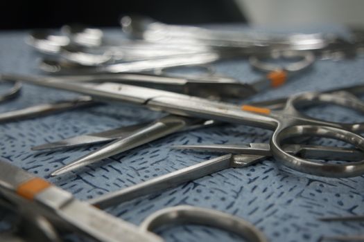 close-up view of sterile medical instruments for surgery on a table in operation theater