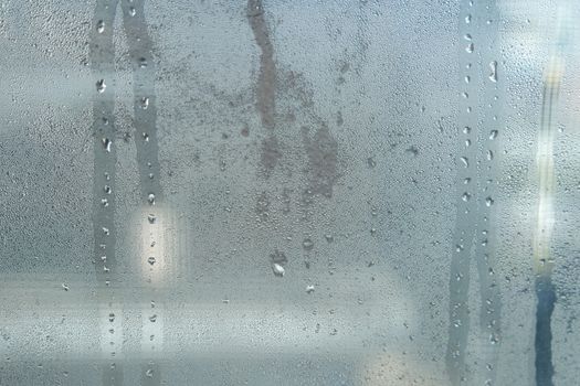 Bright grey color glassy texture, with water drops on it: abstract background
