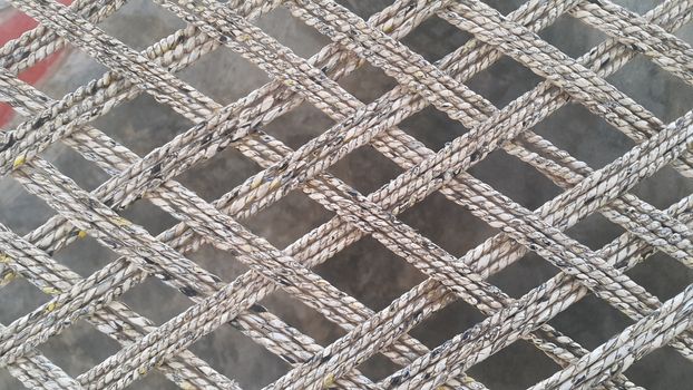 Closeup view of dried jute thread or ropes interwoven for making traditional old style bed called charpai