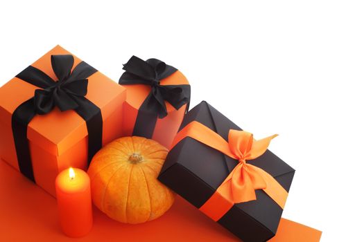 Halloween pumpkin and gifts isolated on white background, corner composition with copy space