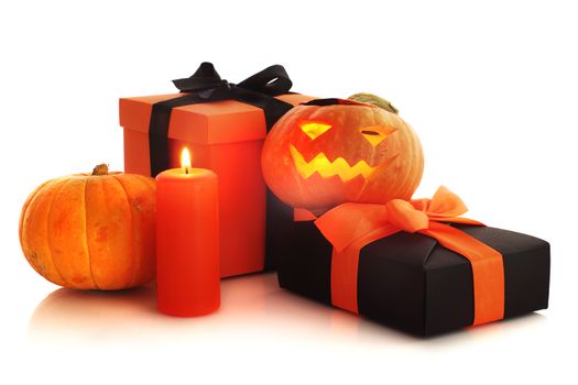 Halloween pumpkin and gifts isolated on white background