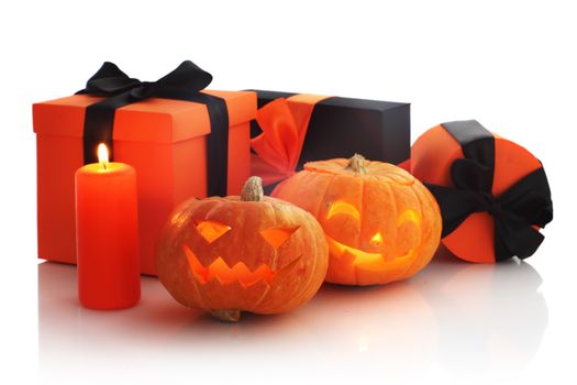 Halloween pumpkin and gifts isolated on white background