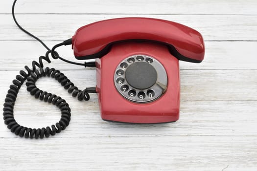 old rotary dial phone,red color
