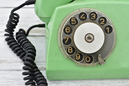 old rotary dial phone, green color