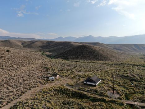 Aerial view of old wood ranch in the middle of the desert valley in Lee Vining, California, USA